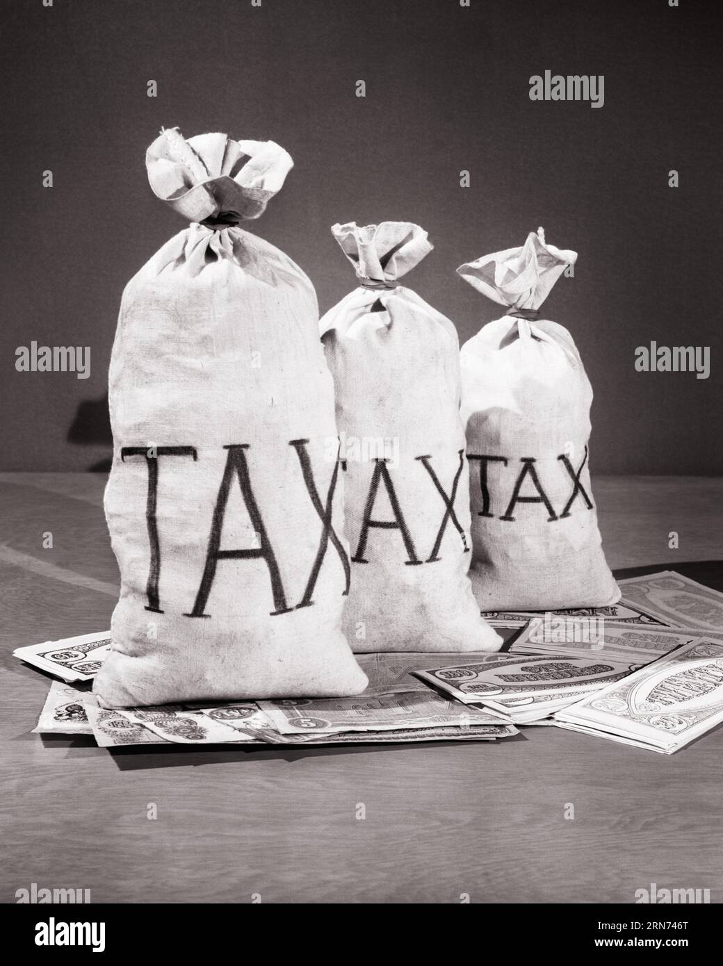 1930s THREE FULL MONEY BAGS LABELED TAX ON TOP OF SAVINGS FINANCIAL