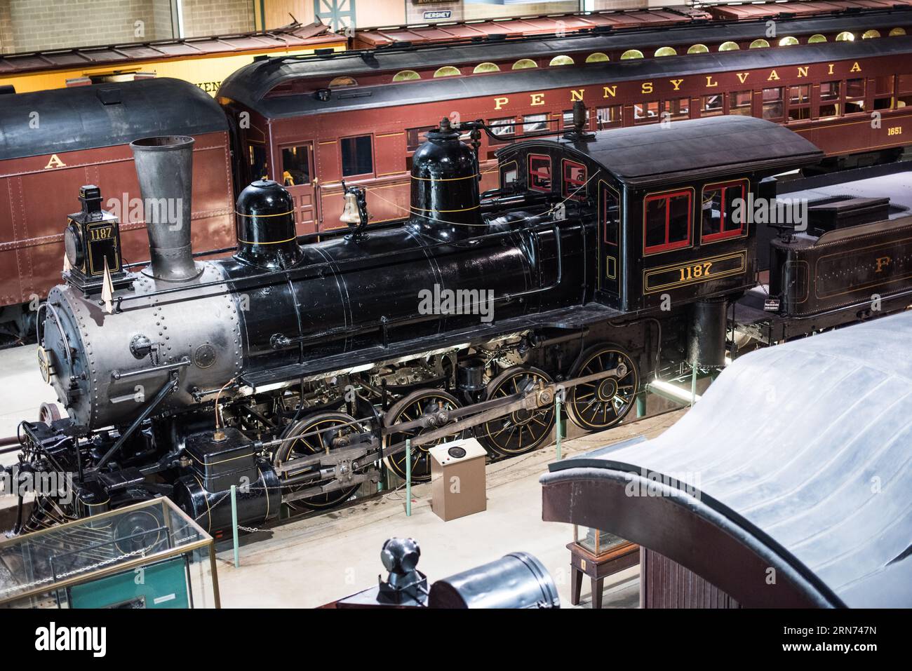 STRASBURG, Pennsylvania, United States — Visitors explore vintage locomotives and train cars at the Railroad Museum of Pennsylvania. Located in Strasburg, the museum preserves Pennsylvania's rich railroading history, housing one of the most significant collections of historic railroad artifacts in the world. Stock Photo