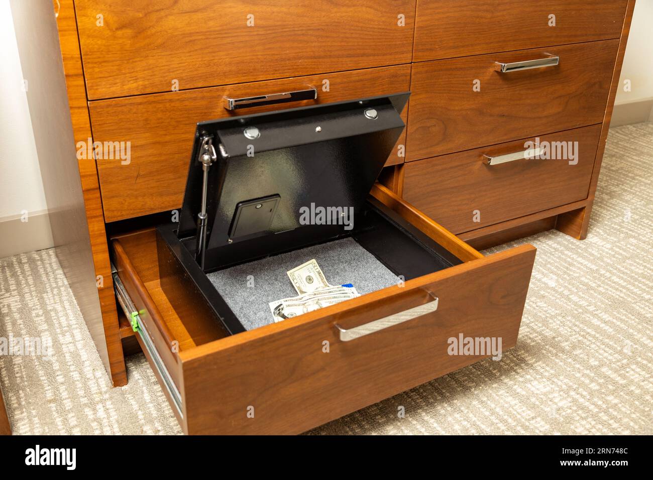 Money and valuables in hotel room safe Stock Photo Alamy