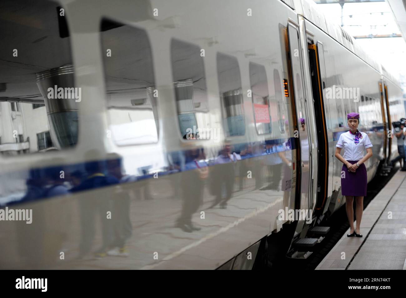 (150817) -- HARBIN, Aug. 17, 2015 -- The high-speed train D7989 prepares to depart for Qiqihar at the Harbin Railway Station in Harbin, capital of northeast China s Heilongjiang Province, Aug. 17, 2015. China s northernmost high-speed railway between two cities of Harbin and Qiqihar in Heilongjiang started operation on Monday. With a designated speed of 250 kilometers per hour and eight stops, the trip from Harbin to Qiqihar was reduced from three hours to 85 minutes. The trains have been modified to adapt to temperatures as low as minus 40 degrees Celsius and resist adverse weather, such as s Stock Photo