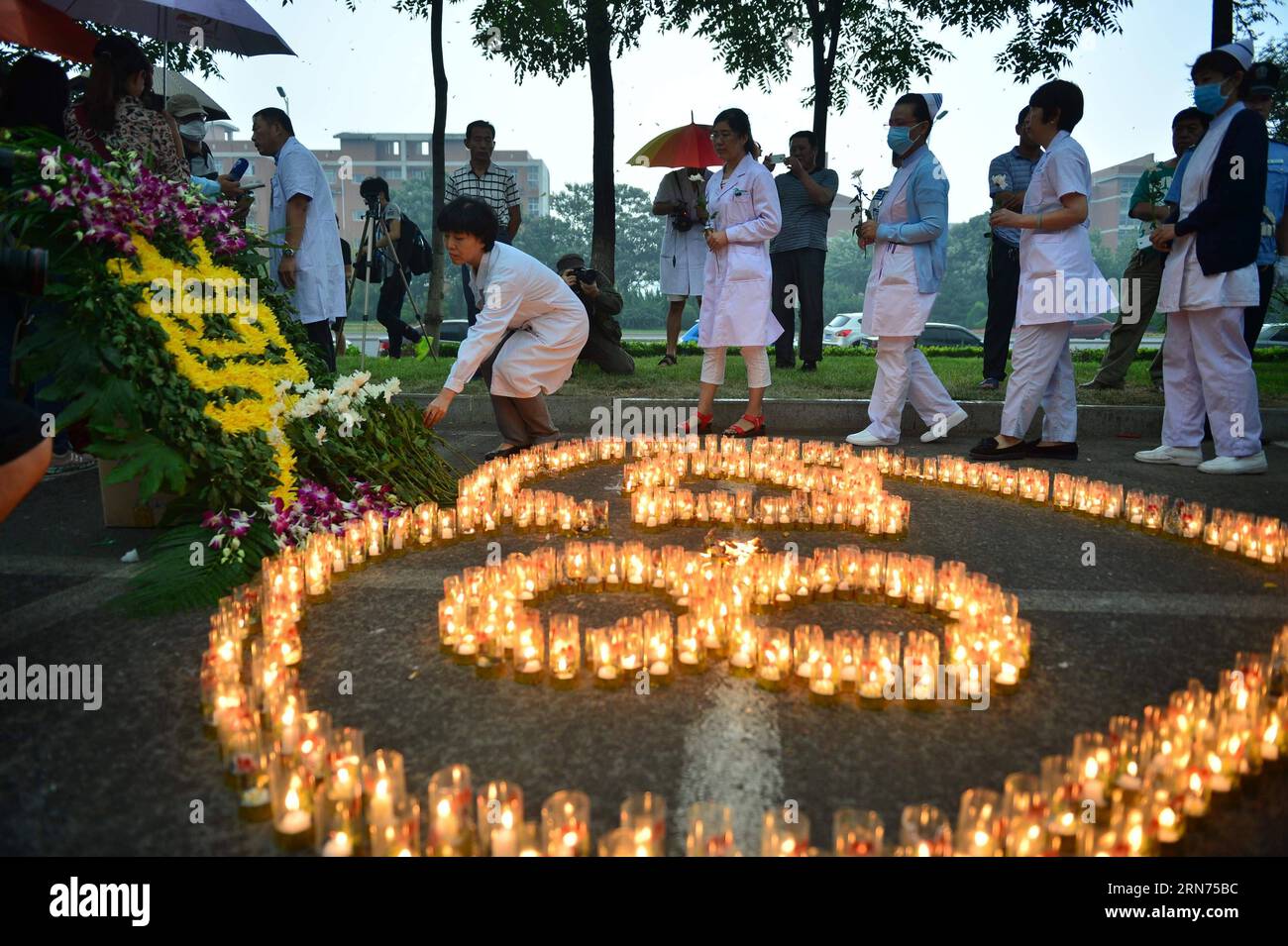 (150818) -- TIANJIN, Aug. 18, 2015 -- A mourning ceremony is held for the victims of the massive warehouse explosions at Taida Hospital near the explosion site in Tianjin, north China, Aug. 18, 2015. The death toll from last week s massive blasts in Tianjin rose to 114.You Sixing) (wyo) CHINA-TIANJIN-EXPLOSION-MOURNING (CN) photomall PUBLICATIONxNOTxINxCHN   150818 Tianjin Aug 18 2015 a Mourning Ceremony IS Hero for The Victims of The Massive Warehouse Explosions AT Taida Hospital Near The Explosion Site in Tianjin North China Aug 18 2015 The Death toll from Load Week S Massive BLAST in Tianji Stock Photo