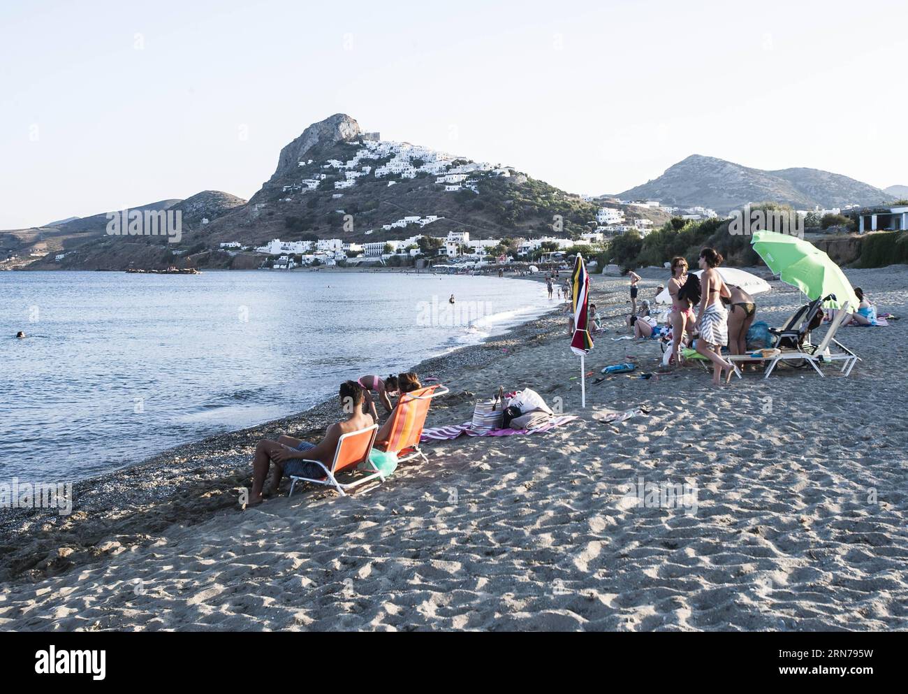 (150827) -- ATHENS,  - People enjoy their holiday on the beach of Skyros, an island about 120 km northeast of the Greek capital of Athens, Aug. 5, 2015. Despite the prolonged economic and political uncertainty, the Association of Greek Tourism Enterprises (SETE) Intelligence experts estimated based on the number of arrivals at airports, ports and land border crossings, that at least 25 million tourists will visit Greece by the end of 2015, exceeding the 2014 record of 24 million visitors. ) GREECE-ATHENS-TOURIST LiuxYongqiu PUBLICATIONxNOTxINxCHN   150827 Athens Celebrities Enjoy their Holiday Stock Photo