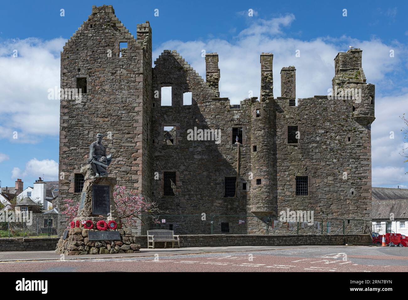 Kirkcudbright, Scotland, UK - April 25th 2023 - Ancient castle ruins at Kirkcudbright Scotland under renovation with a mannequin in the window Stock Photo
