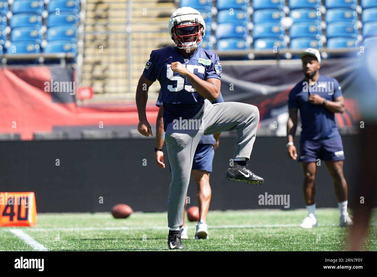 New England Patriots linebacker Josh Uche (55) lines up against