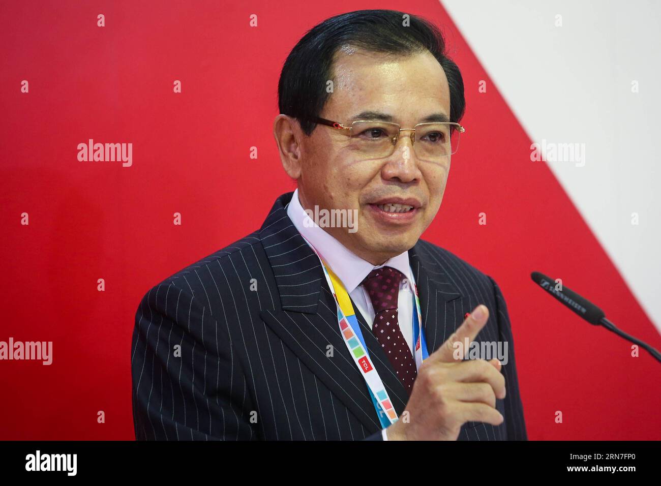 (150904) -- BERLIN, Sept. 4, 2015 -- Li Dongsheng, Chairman of TCL Cooperation, speaks during the opening ceremony of China Brand Show at the 55th IFA consumer electronics fair in Berlin, Germany, on Sept. 4, 2015. More than 150 exhibitors from China would present their latest products at this year s IFA consumer electronics fair, Europe s largest consumer electronics and home appliances fair, which kicked off on Friday in Berlin. ) GERMANY-BERLIN-IFA CONSUMER ELECTRONICS FAIR-CHINA-EXHIBITORS ZhangxFan PUBLICATIONxNOTxINxCHN   150904 Berlin Sept 4 2015 left Dongsheng Chairman of TCL Cooperati Stock Photo