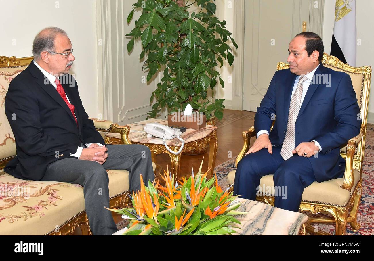 (150913) -- CAIRO , Sept. 13, 2015 -- The handout photo from Egypt s state-run news agency shows Egyptian President Abdel-Fattah al-Sisi (R) meeting with outgoing Petroleum Minister Sherif Ismail at the Presidential Palace in Cairo, Egypt, on Sept. 12, 2015. Egyptian President Abdel-Fattah al-Sisi accepted on Saturday the cabinet resignation headed by Prime Minister Ibrahim Mehleb, according to a statement from the president office. The outgoing Petroleum Minister Sherif Ismail was then asked by Sisi to form a new government within a week. ) EGYPT-CAIRO-POLITICS-CABINET-RESIGNATION MENA PUBLIC Stock Photo