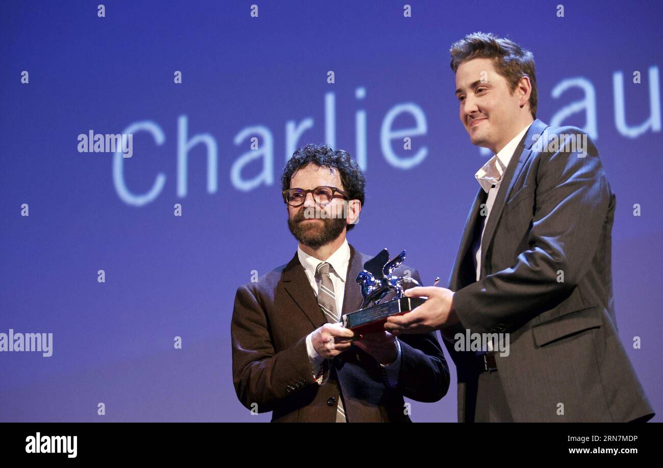 (150912) -- VENICE, Sept. 12, 2015 -- American directors Charlie Kaufman (L) and Duke Johnson pose with the Grand Jury Prize for their movie Anomalisa , during the award ceremony at the 72nd Venice Film Festival, at the Lido of Venice, Italy, Sept. 12, 2015. ) ITALY-VENICE-FILM-FESTIVAL-72ND-AWARD-GRAND JURY JinxYu PUBLICATIONxNOTxINxCHN   Venice Sept 12 2015 American Directors Charlie Kaufman l and Duke Johnson Pose With The Grand Jury Prize for their Movie  during The Award Ceremony AT The 72nd Venice Film Festival AT The Lido of Venice Italy Sept 12 2015 Italy Venice Film Festival 72nd Awar Stock Photo