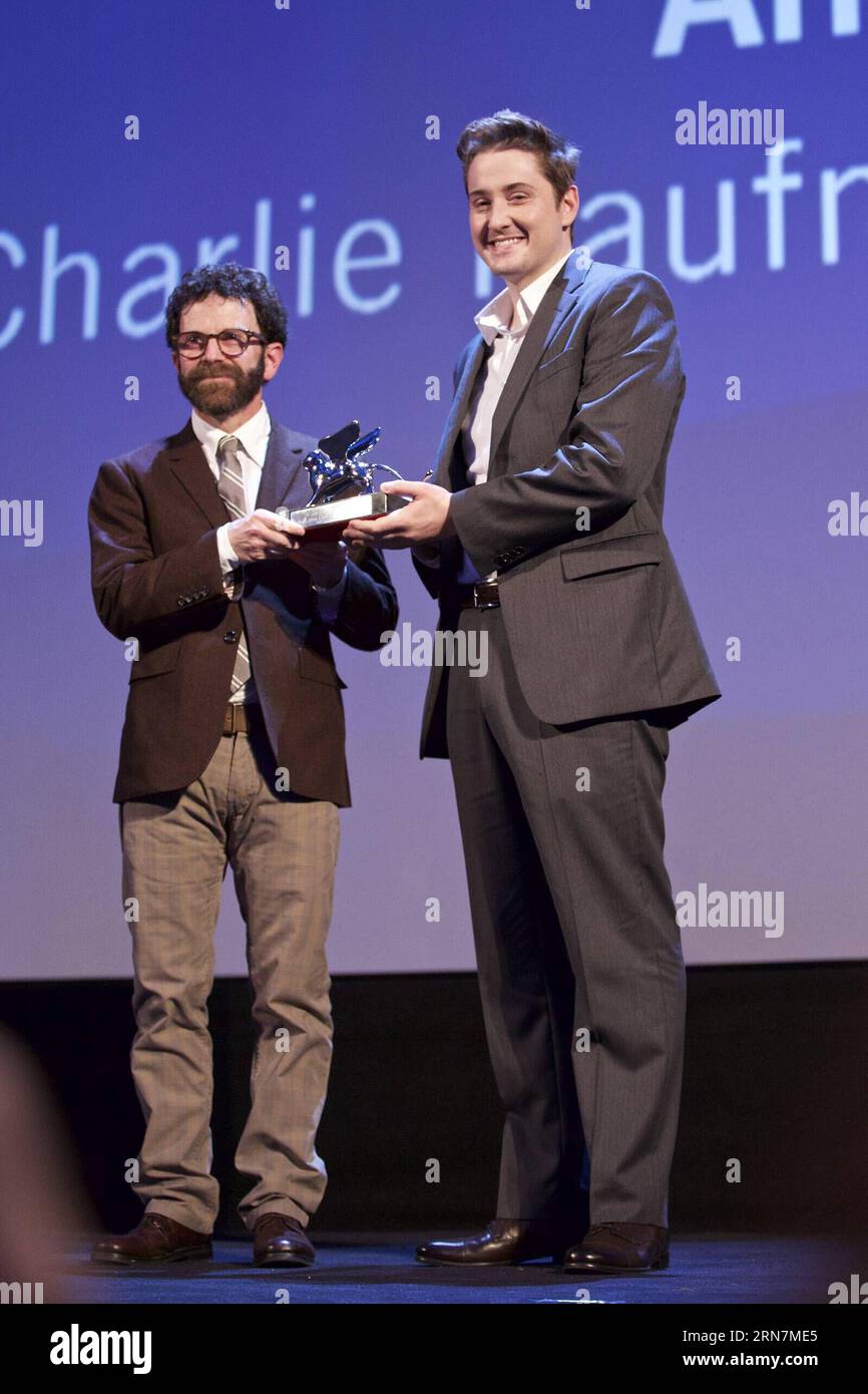 (150912) -- VENICE, Sept. 12, 2015 -- American directors Charlie Kaufman (L) and Duke Johnson pose with the Grand Jury Prize for their movie Anomalisa , during the award ceremony at the 72nd Venice Film Festival, at the Lido of Venice, Italy, Sept. 12, 2015. ) ITALY-VENICE-FILM-FESTIVAL-72ND-AWARD-GRAND JURY JinxYu PUBLICATIONxNOTxINxCHN   Venice Sept 12 2015 American Directors Charlie Kaufman l and Duke Johnson Pose With The Grand Jury Prize for their Movie  during The Award Ceremony AT The 72nd Venice Film Festival AT The Lido of Venice Italy Sept 12 2015 Italy Venice Film Festival 72nd Awar Stock Photo