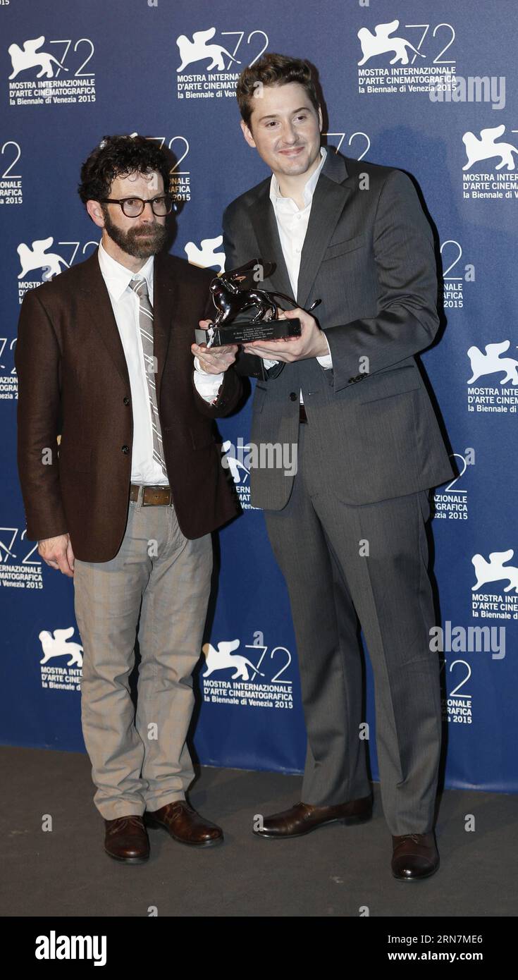 (150912) -- VENICE, Sept. 12, 2015 -- American directors Charlie Kaufman (L) and Duke Johnso pose with the Grand Jury Prize for their movie Anomalisa , as they attend the award winners photocall during the 72nd Venice Film Festival, at the Lido of Venice, Italy, Sept. 12, 2015. ) ITALY-VENICE-FILM-FESTIVAL-72ND-AWARD YexPingfan PUBLICATIONxNOTxINxCHN   Venice Sept 12 2015 American Directors Charlie Kaufman l and Duke  Pose With The Grand Jury Prize for their Movie  As They attend The Award winners photo call during The 72nd Venice Film Festival AT The Lido of Venice Italy Sept 12 2015 Italy Ve Stock Photo