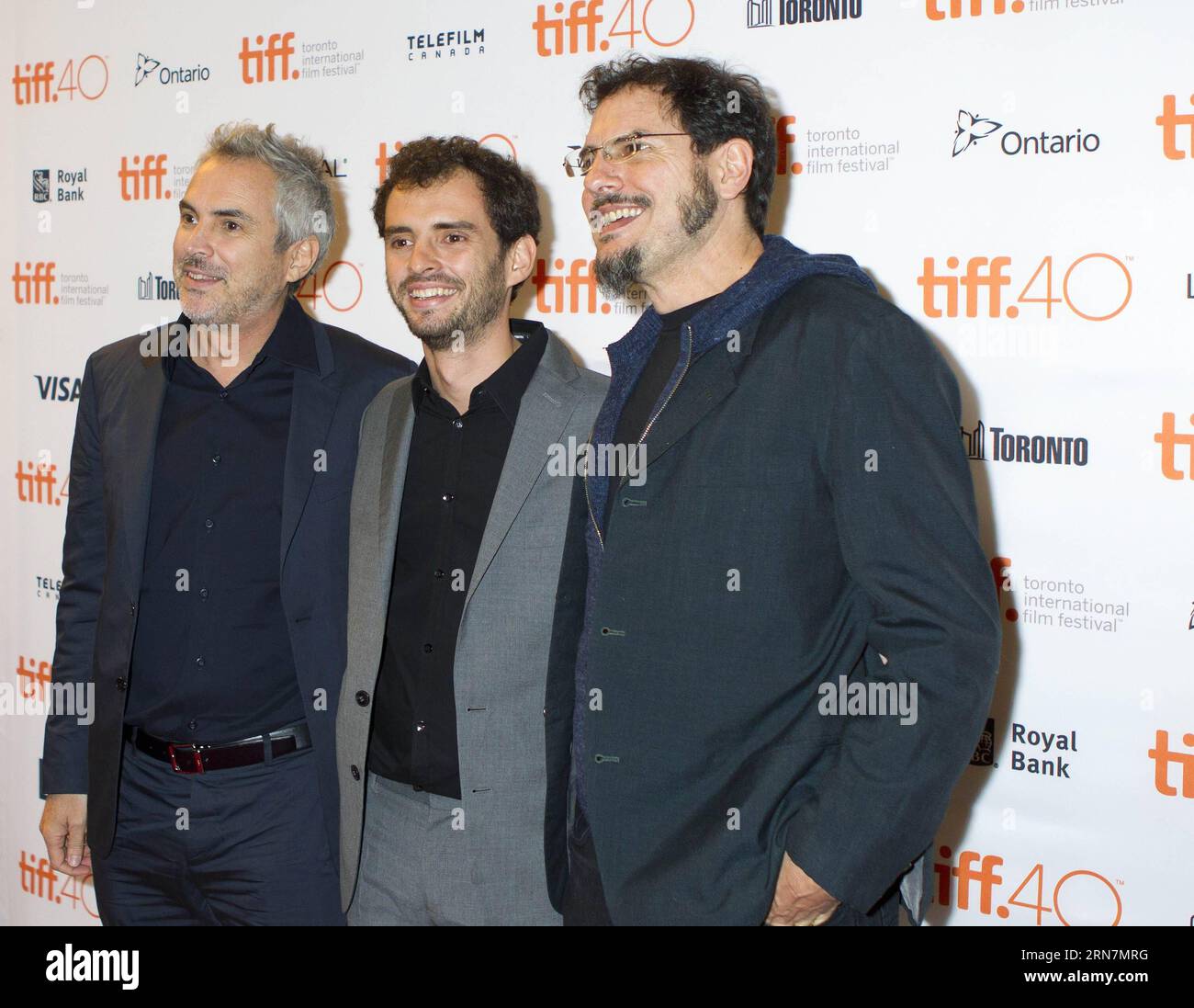 (150914) -- TORONTO, Sept. 13, 2015 -- Directors Alfonso Cuaron (L) and Jonas Cuaron (C) pose for photos before the world premiere of film Desierto at the Elgin Theater during the 40th Toronto International Film Festival in Toronto, Canada, on Sept. 13, 2015. ) CANADA-TORONTO-40TH TORONTO INTERNATIONAL FILM FESTIVAL- DESIERTO ZouxZheng PUBLICATIONxNOTxINxCHN   150914 Toronto Sept 13 2015 Directors Alfonso Cuaron l and Jonas Cuaron C Pose for Photos Before The World Premiere of Film Desierto AT The Elgin Theatre during The 40th Toronto International Film Festival in Toronto Canada ON Sept 13 20 Stock Photo