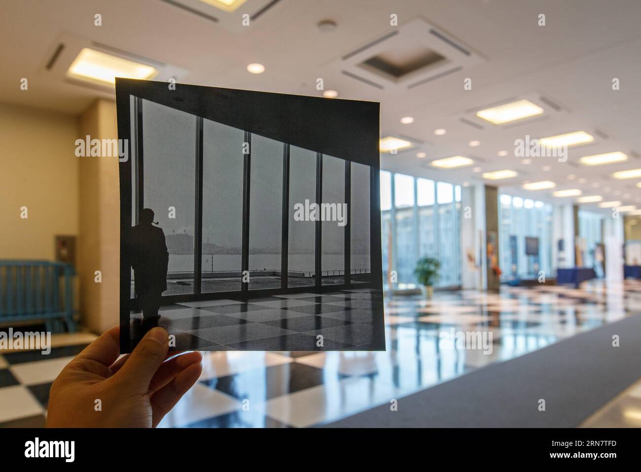 Photo taken on Sept. 19, 2015 shows the main lobby of the United Nations Secretariat building in New York, compared with a photo taken at the same place in 1952. In 1945, representatives of 50 countries met in San Francisco at the the United Nations Conference on International Organization to draw up the United Nations Charter, which was signed on June 26, 1945 by representatives of 50 countries. The United Nations officially came into existence on Oct. 24, 1945, when the Charter had been ratified by China, France, the Soviet Union, the United Kingdom, the United States and by a majority of ot Stock Photo