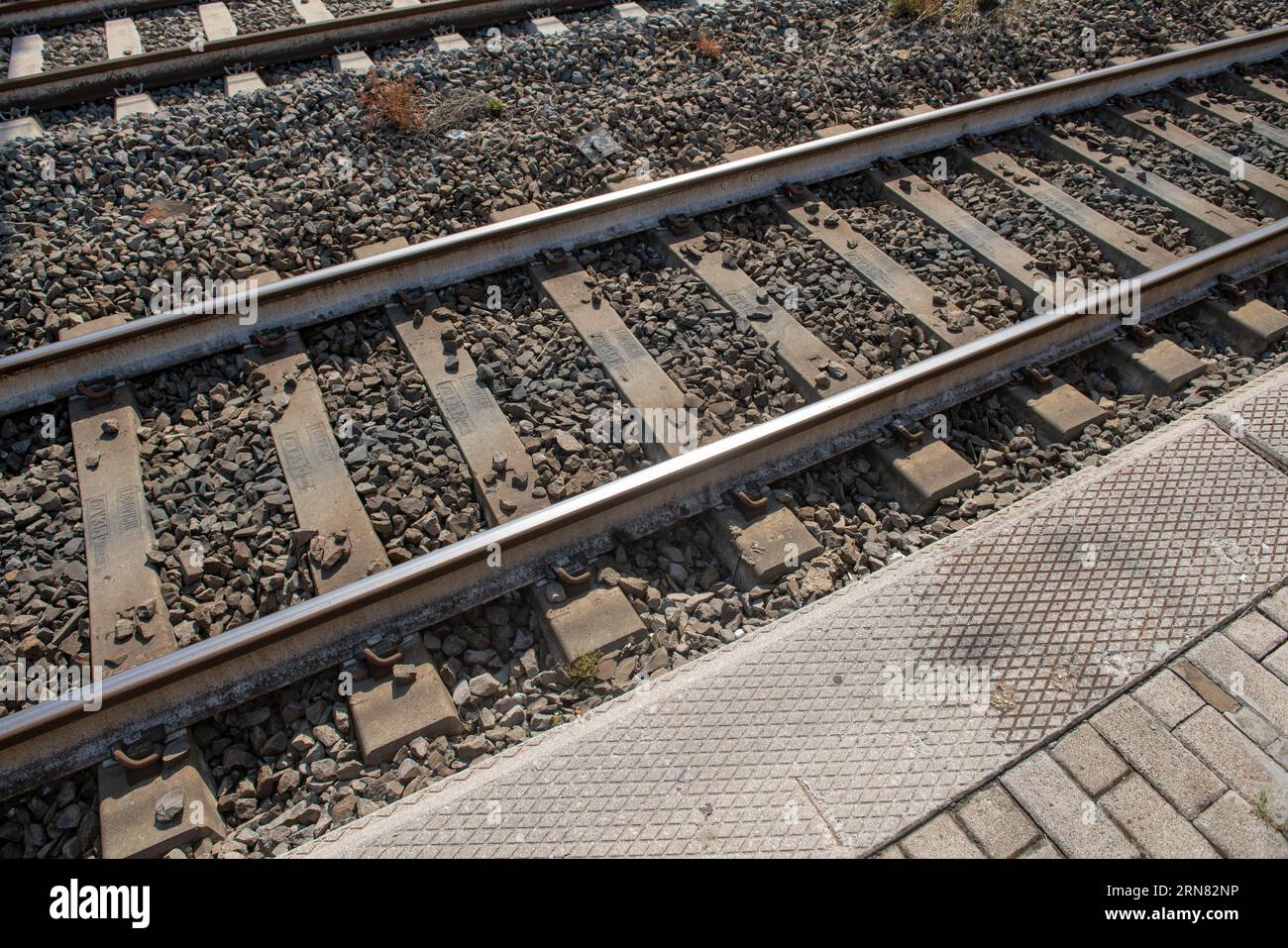 Railway tracks, the empty tracks with concrete sleepers, of a railway
