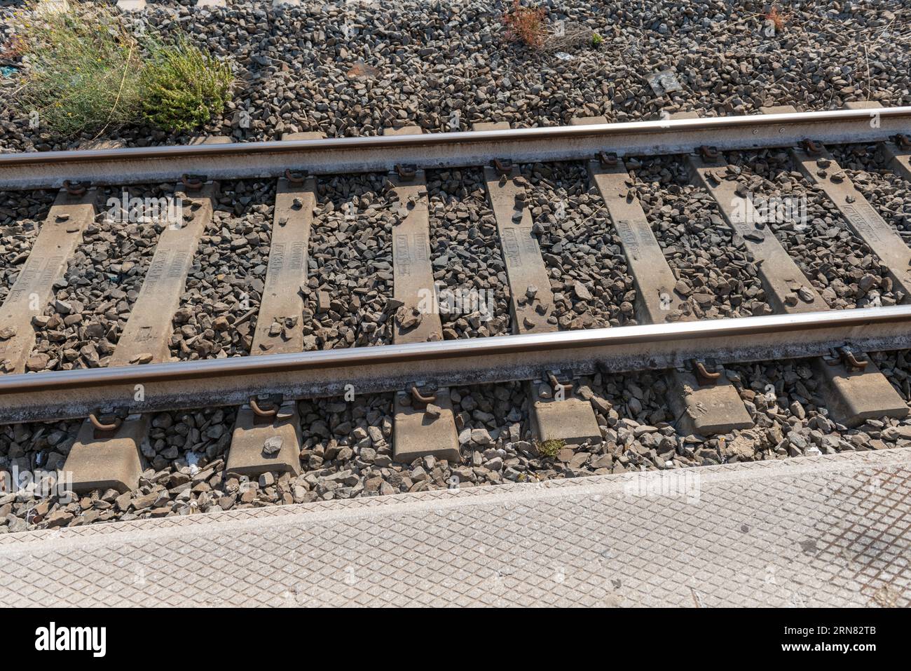 Railway tracks, the empty tracks with concrete sleepers, of a railway
