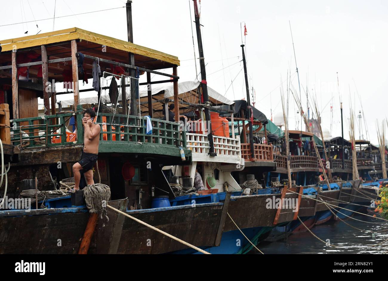 (151003) -- HAIKOU, Oct. 3, 2015 -- Ships berth at Xingang harbor in Haikou, capital of south China s Hainan Province, Oct. 3, 2015. A tropical depression strengthened to become Typhoon Mujigae early Friday morning, and the storm was still gathering power as it entered the eastern part of the South China sea. ) (zkr) CHINA-HAINAN-TYPHOON MUJIGAE-APPROACHING(CN) ZhaoxYingquan PUBLICATIONxNOTxINxCHN   Haikou OCT 3 2015 Ships Berth AT Xingang Harbor in Haikou Capital of South China S Hainan Province OCT 3 2015 a Tropical Depression strengthened to Become Typhoon Mujigae Early Friday Morning and T Stock Photo