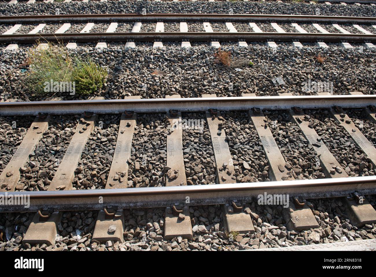 Railway tracks, the empty tracks with concrete sleepers, of a railway