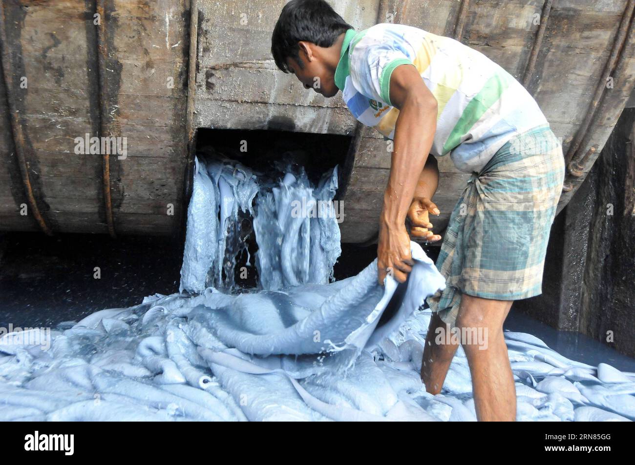 DHAKA, Oct. 7, 2015 -- A man works in a leather factory at Hazaribagh in Dhaka, capital of Bangladesh, on Oct. 7, 2015. Bangladesh s tannery industry looks set to suffer a big blow as demand for finished leather and leather products in major international markets has been plunging amid grave concerns over the environmental hazard created by the country s leather industry. ) BANGLADESH-DHAKA-TANNERY SharifulxIslam PUBLICATIONxNOTxINxCHN   Dhaka OCT 7 2015 a Man Works in a Leather Factory AT Hazaribagh in Dhaka Capital of Bangladesh ON OCT 7 2015 Bangladesh S tannery Industry Looks Set to suffer Stock Photo