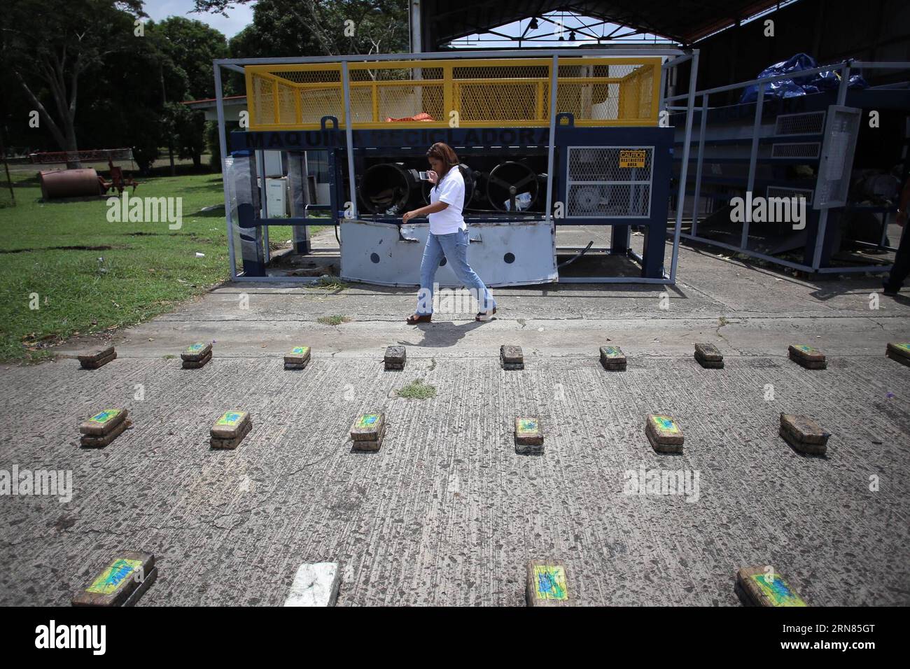 PANAMA CITY, Oct. 7, 2015 -- A woman walks near packages of drug and recycling machines during a press conference in Panama City, capital of Panama, on Oct. 7, 2015. Units of the National Police seized 552 packages of drug hidden inside two recycling machines, said the Director of Operations of the National Police Jose Rios. According to the institution, five people involved were captured, two from Panama, two Colombians and one from Haiti. ) PANAMA-PANAMA CITY-SECURITY-DRUG TRAFFICKING MauricioxValenzuela PUBLICATIONxNOTxINxCHN   Panama City OCT 7 2015 a Woman Walks Near Packages of Drug and Stock Photo