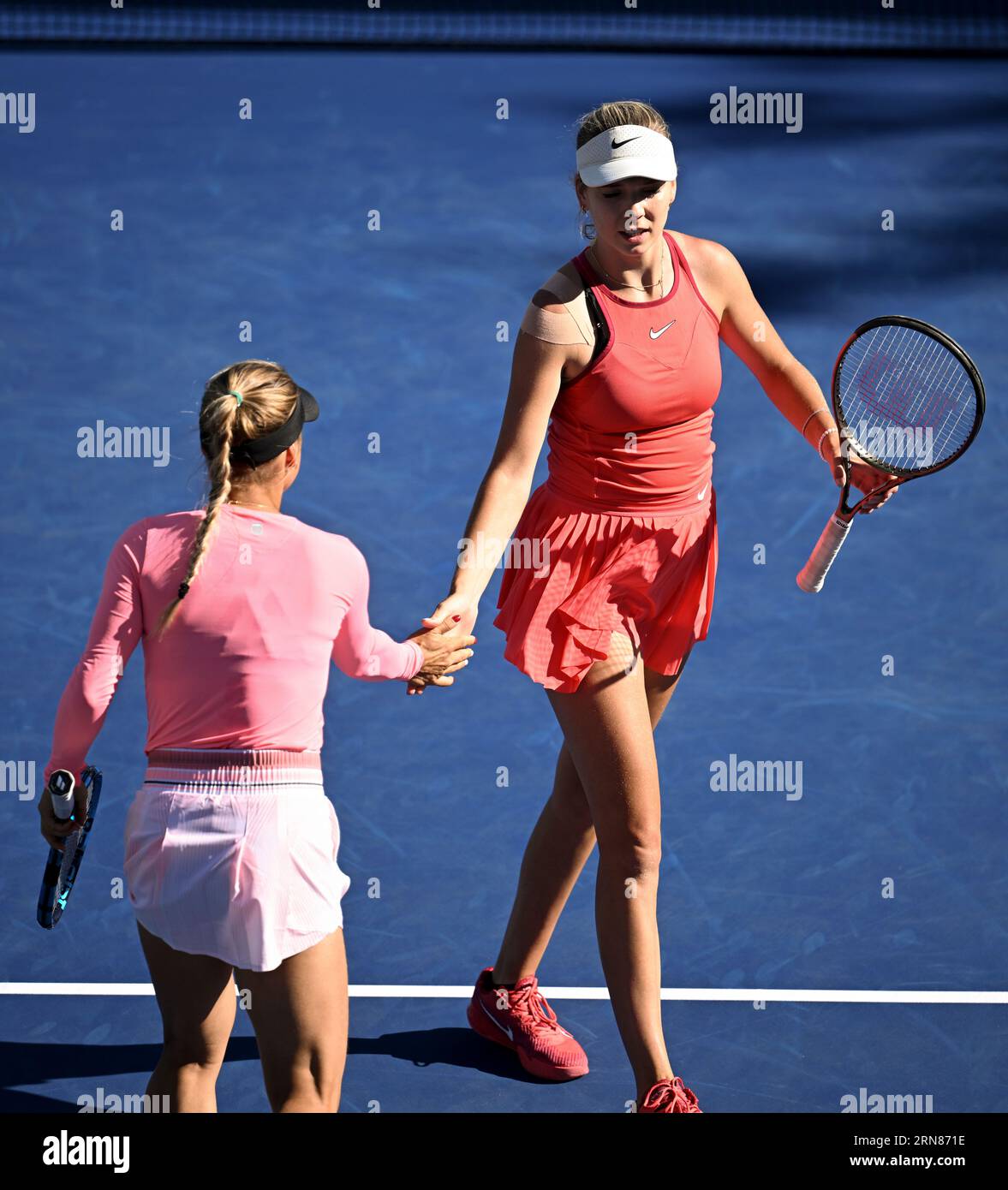 Katie Boulter and Yulia Putintseva in action during a women's doubles