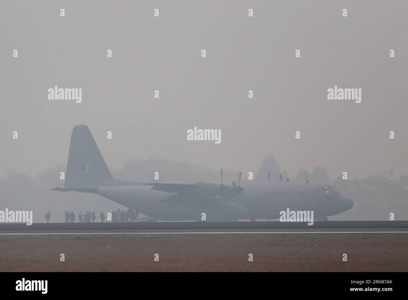 A C-130 Hercules plane from Malyasian Air Force lands at Sultan Mahmud Baddarudin II airport to help Indonesian government fight forest fire in Palembang, Indonesia, Oct. 9, 2015. Indonesian President Joko Widodo said on Thursday that he had sought help from Singapore, Malaysia, Russia and Japan to extinguish the forest and agriculture fires on the islands of Sumatra and Kalimantan, whose haze has affected Singapore and Malaysia. A fire-fighting team from Singapore has arrived in Indonesia on Friday with more teams from Malaysia, Australia, Russia, China and South Korea expected to arrive in t Stock Photo