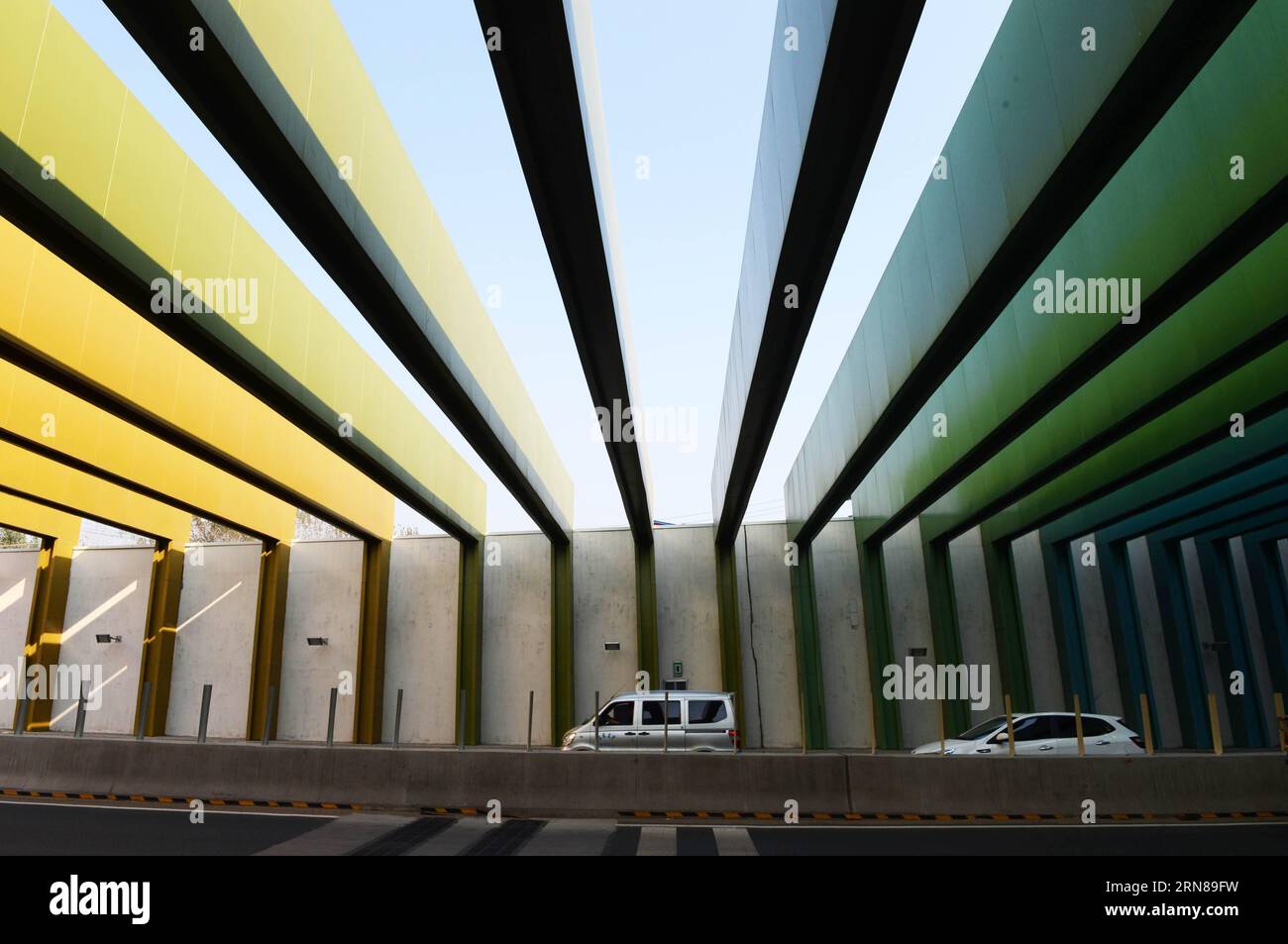  151013 zhengzhou oct 13 2015 cars run into a rainbow like