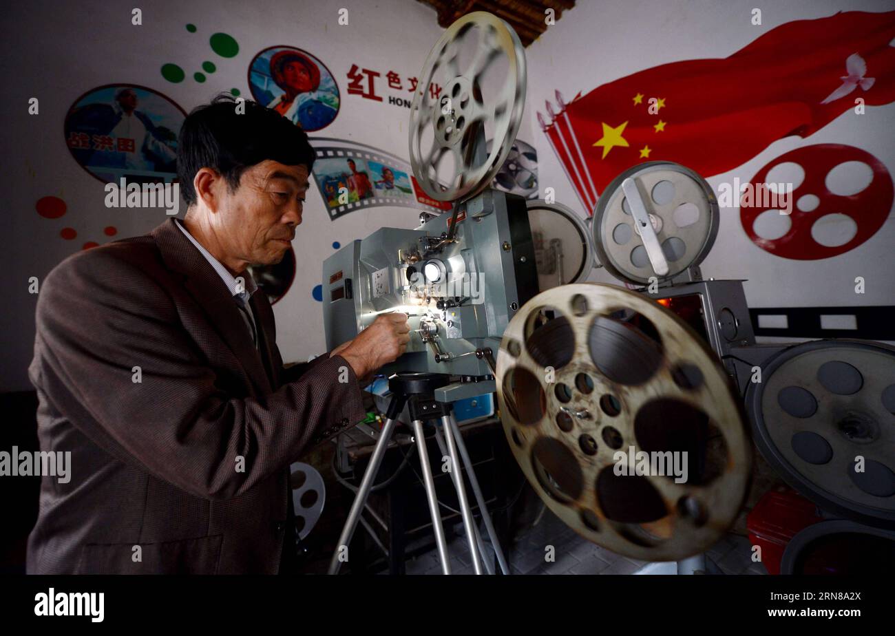 SHIJIAZHUANG, Oct. 13, 2015 -- Wei Shaoxian operates a film projector at his film museum in Siliugu Village of Handan County, north China s Hebei Province, Oct. 13, 2015. Cinephile Wei Shaoxian collected more than 20,000 items about film, such as filmstrip, poster and record, since 2004 and founded his private film museum in his village in 2015. ) (zkr) CHINA-SHIJIAZHUANG-FILM MUSEUM(CN) WangxXiao PUBLICATIONxNOTxINxCHN   Shijiazhuang OCT 13 2015 Wei  operates a Film projector AT His Film Museum in  Village of Handan County North China S Hebei Province OCT 13 2015  Wei  collected More than 20 Stock Photo