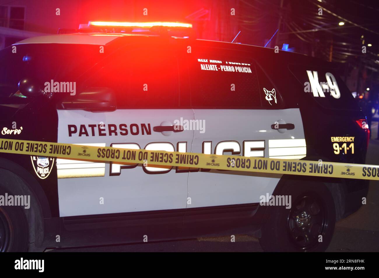 Paterson, United States. 30th Aug, 2023. Crime scene tape and Paterson police vehicles block the area surrounding the crime scene. Two people were shot in Paterson. The two victims were brought to the hospital, Wednesday evening after being shot around 8:49 PM. Multiple police vehicles and officers were present at the scene, investigating the shooting. (Photo by Kyle Mazza/SOPA Images/Sipa USA) Credit: Sipa USA/Alamy Live News Stock Photo