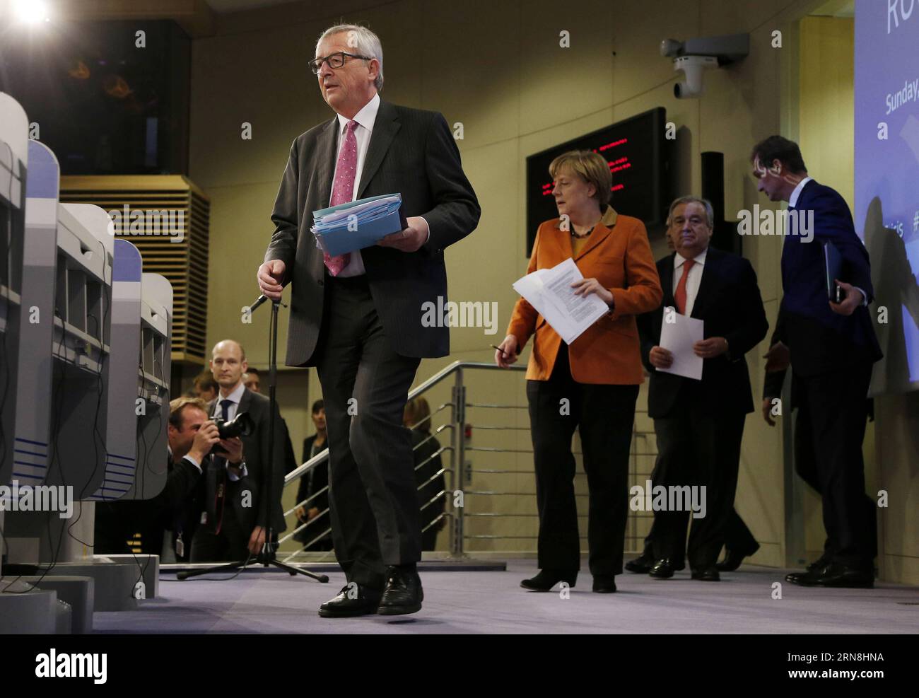European Commission President Jean-Claude Juncker (L, front), German Chancellor Angela Merkel (C, front) and the UN s High Commissioner for Refugees Antonio Guterres (R, front) arrive for a press conference at the end of the special EU summit with Western Balkan nations situated along the migrant routes into Europe in Brussels, Belgium, on Oct. 26, 2015. The European Union (EU) and Balkan countries are seeking further cooperation on tackling migrant crisis at a mini summit held here on Sunday. Zhou Lei) BELGIUM-EU SPECIAL SUMMIT-REFUGEE-WESTERN BALKAN ?? PUBLICATIONxNOTxINxCHN   European Commi Stock Photo