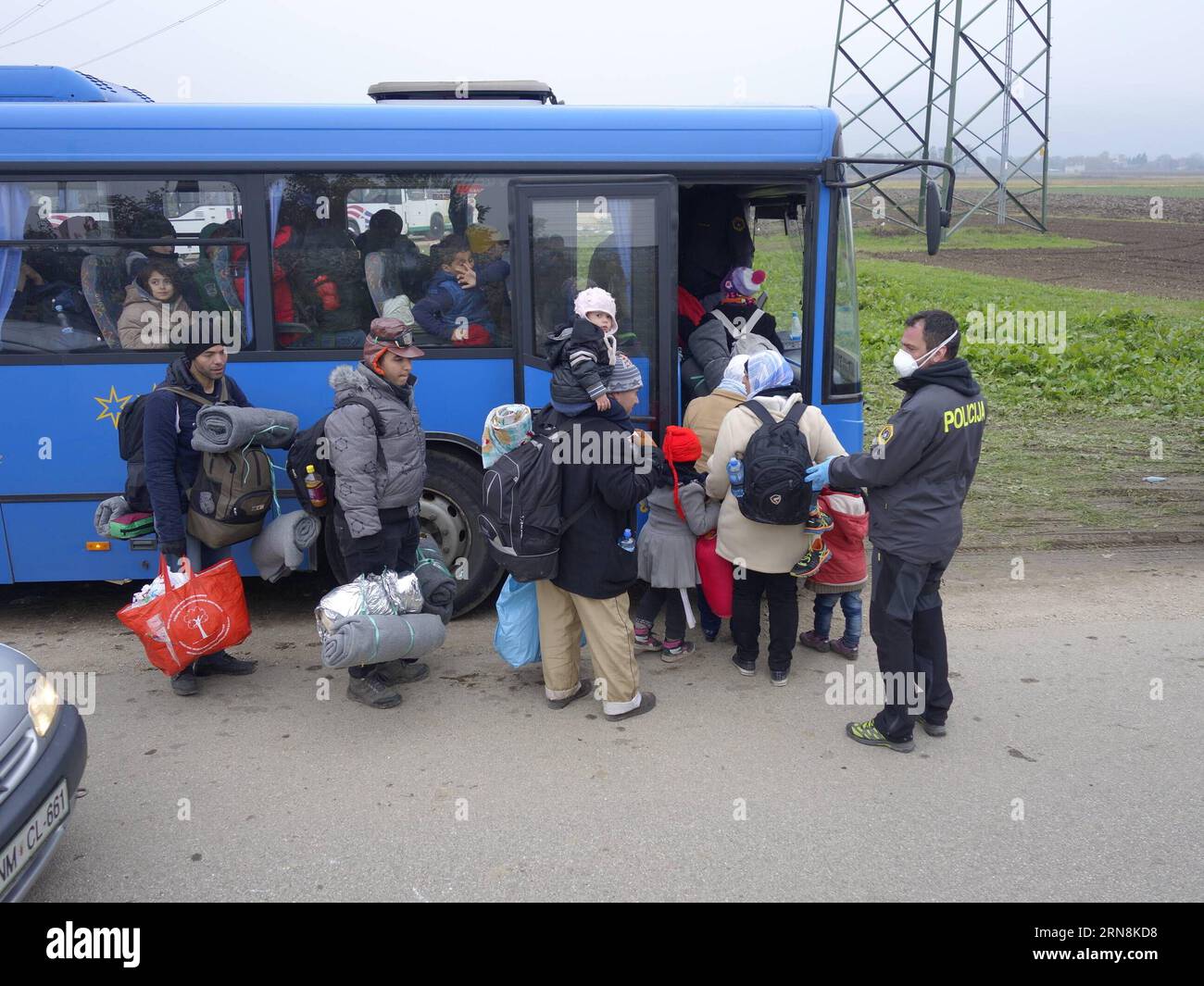 Refugees coming from Croatia by train queue to get on buses to be transfered to the refugee centre inland Slovenia in Rigonce, a tiny Slovenian border town with Croatia on on Oct. 27, 2015. By midday on Tuesday over 5,800 refugees had entered Slovenia, bringing the total to almost 86,500 so far this year, according to the STA latest report.) SLOVENIA-RIGONCE-REFUGEE wangxyaxiong PUBLICATIONxNOTxINxCHN   Refugees Coming from Croatia by Train Queue to Get ON Buses to Be transferred to The Refugee Centre Domestically Slovenia in  a Tiny Slovenian Border Town With Croatia ON ON OCT 27 2015 by midd Stock Photo