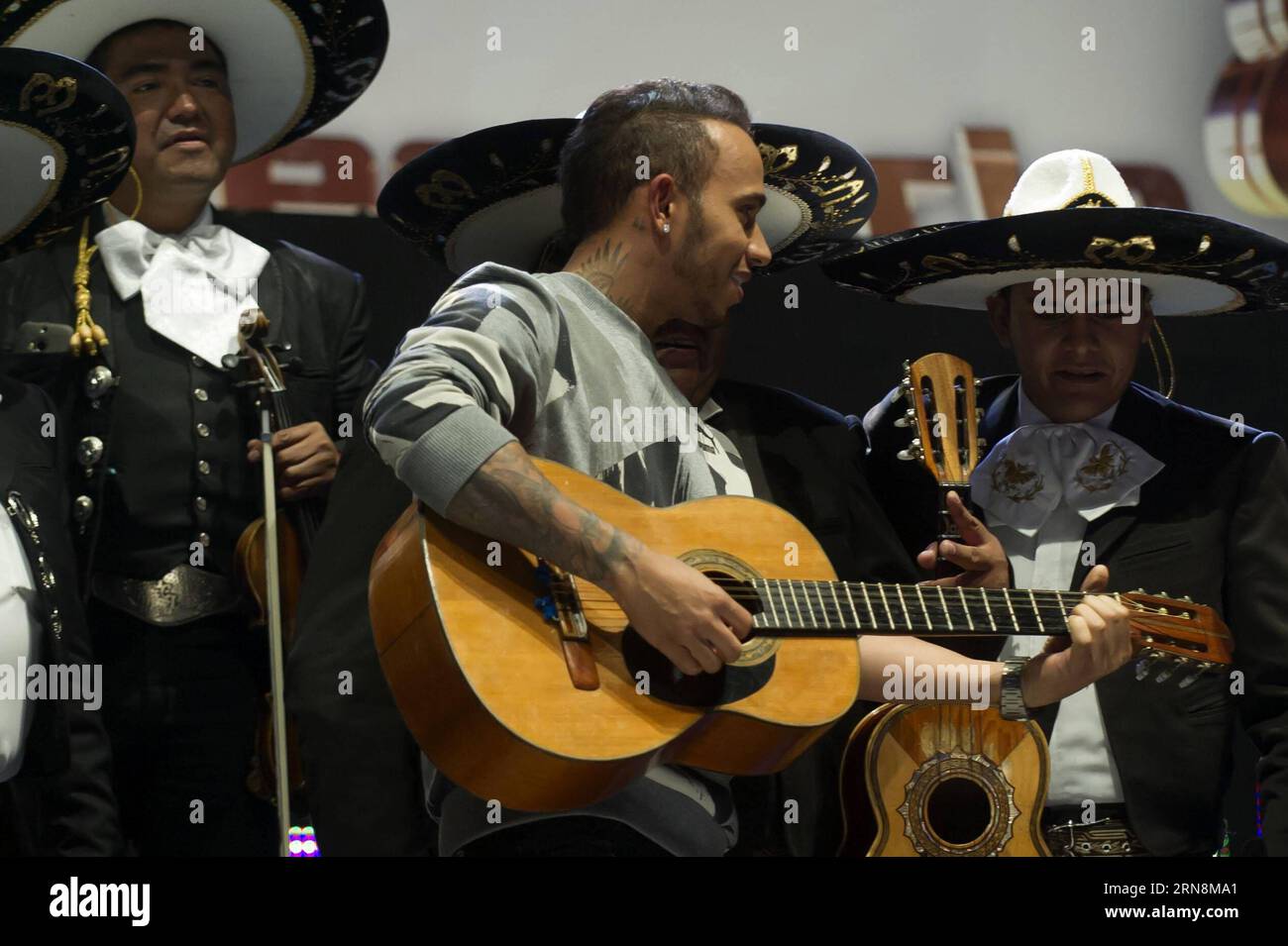 (151029) -- MEXICO CITY,  - British driver Lewis Hamilton of Mercedes team, plays guitar during his visit to Arena Mexico, prior to the F1 Mexican Grand Prix, in Mexico City, capital of Mexico, on Oct. 28, 2015. According to local press, Lewis Hamilton visited on Wednesday the Arena Mexico, where he watched a wrestling exhibition and played a match of table football at the ring with Mexican soccer player Oribe Peralta. The F1 Mexican Grand Prix will be held from Oct. 30 to Nov. 1, in Mexico City. ) (SP)MEXICO-MEXICO CITY-AUTOMOBILE-F1 OSCARxRAMIREZ PUBLICATIONxNOTxINxCHN   Mexico City British Stock Photo