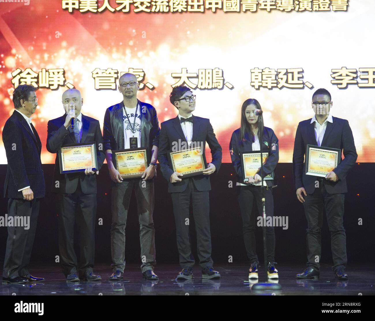 (151104) -- LOS ANGELES, Nov. 3, 2015 -- Xu Zheng, Guan Hu, Da Peng, Li Yu and Han Yan (from 2nd L to R) receive the Certificate of Excellent Chinese Young Directors at the Ricardo Montalban Theatre during the Chinese American Film Festival in Los Angeles, the United States, on Nov. 3, 2015. ) US-LOS ANGELES-CHINESE AMERICAN FILM FESTIVAL YangxLei PUBLICATIONxNOTxINxCHN   Los Angeles Nov 3 2015 Xu Zheng Guan HU there Peng left Yu and Han Yan from 2nd l to r receive The Certificate of Excellent Chinese Young Directors AT The Ricardo Mont Alban Theatre during The Chinese American Film Festival i Stock Photo