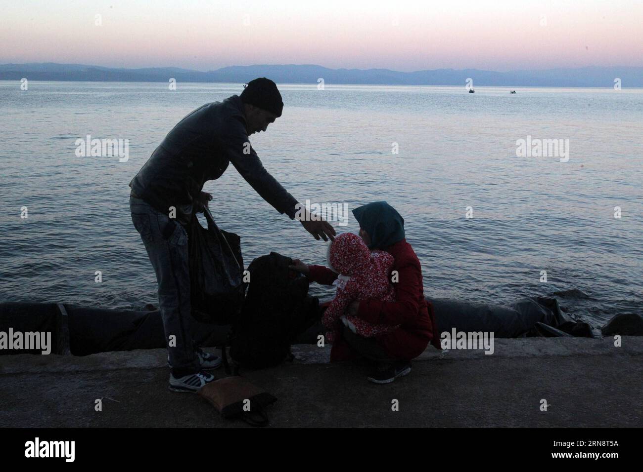 (151104) -- ATHENS, Nov. 4, 2015 -- Refugees arrive at the Greek island of Lesvos after crossing the Aegean Sea from Turkey, Nov. 4, 2015. More than 600,000 refugees have arrived at Greece from the beginning of 2015, with about half of them landing at the Lesvos island, about 260 km northeast of the capital Athens. ) GREECE-LESVOS-REFUGEES MariosxLolos PUBLICATIONxNOTxINxCHN   Athens Nov 4 2015 Refugees Arrive AT The Greek Iceland of Lesvos After Crossing The Aegean Sea from Turkey Nov 4 2015 More than 600 000 Refugees have arrived AT Greece from The BEGINNING of 2015 With About Half of THEM L Stock Photo