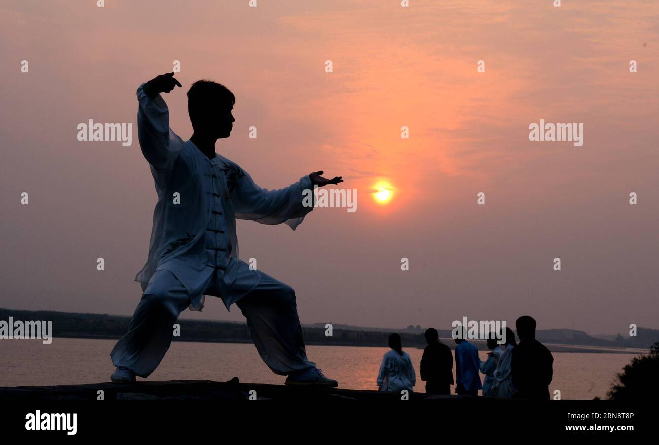 A man practices Taiji by the Yellow River at Chenjiagou Village in Wenxian  County, central China s Henan Province, Oct. 29, 2015. Often shortened to  taiji, t ai chi or tai chi