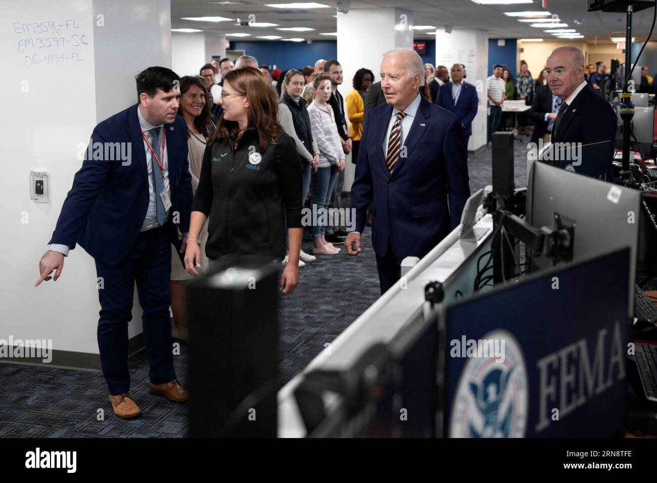 United States President Joe Biden departs Federal Emergency Management Agency (FEMA) headquarters in Washington, DC on August 31, 2023. Also pictured are FEMA Associate Administrator of the Office of Response and Recovery Anne Bink and US Secretary of Homeland Security Alejandro Mayorkas.Credit: Yuri Gripas/Pool via CNP/MediaPunch Stock Photo