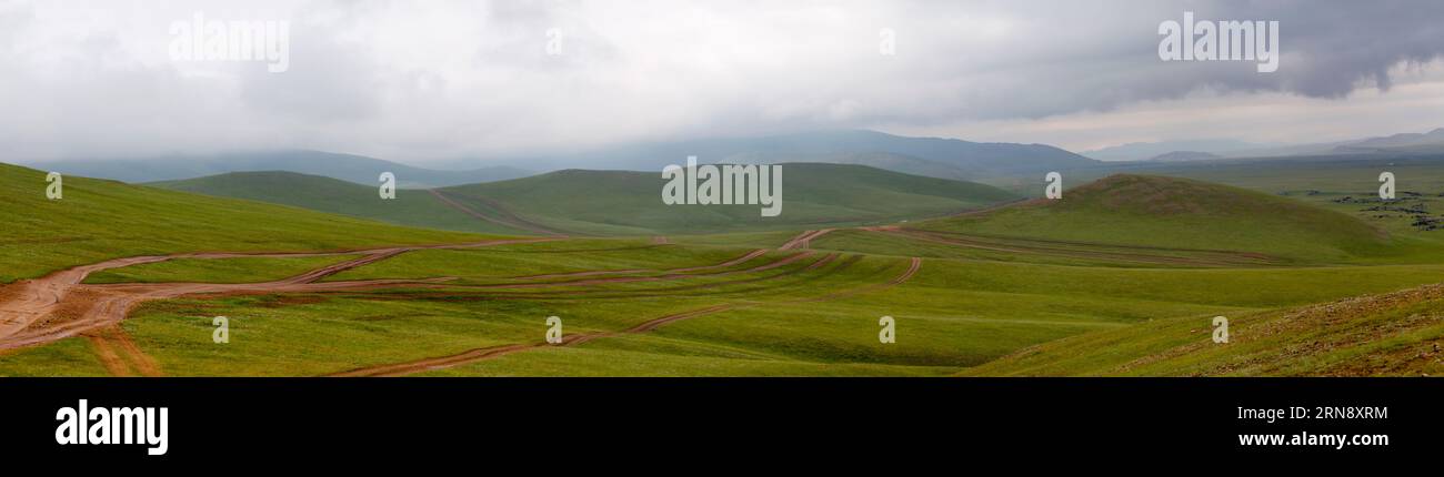 Panoramic view of a dirt road in the Orkhon valley in Mongolia. Stock Photo