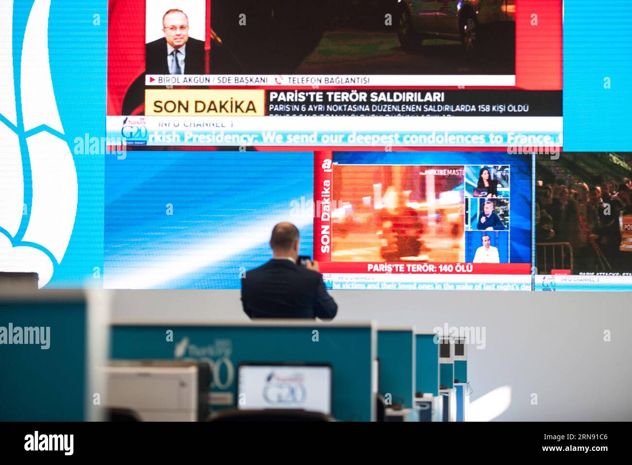 A staff films the news broadcasting Paris attacks on screen at the press center of G20 summit, in Antalya, a Mediterranean resort city of Turkey, on Nov. 13, 2015. French President Francois Hollande canceled his trip to Turkey for the upcoming G20 summit because of the multiple attacks in Paris on Friday. ) TURKEY-ANTALYA-FRENCH PRESIDENT-TRIP-CANCEL PanxChaoyue PUBLICATIONxNOTxINxCHN   a Staff Films The News Broadcasting Paris Attacks ON Screen AT The Press Center of G20 Summit in Antalya a Mediterranean Resort City of Turkey ON Nov 13 2015 French President François Hollande canceled His Trip Stock Photo