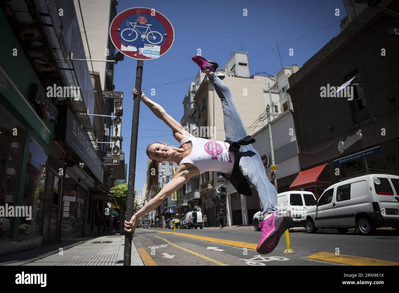 (151121) -- BUENOS AIRES, Nov. 20, 2015 -- A dancer performs a choreography of Pole Dance at Av. Corrientes in Buenos Aires, capital of Argentina, on Nov. 20, 2015. According to local press, the dancers prepare to compete in the event of Miss Pole Dance Argentina and South America that will take place on Nov. 23, with competitors from Argentina, Peru, Brazil, Bolivia, Paraguay, Chile, Ecuador, Colombia and Venezuela. Martin Zabala) (vf) (sp) ARGENTINA-BUENOS AIRES-SOCIETY-POLE DANCE e MARTINxZABALA PUBLICATIONxNOTxINxCHN   151121 Buenos Aires Nov 20 2015 a Dancer performs a choreography of Pol Stock Photo