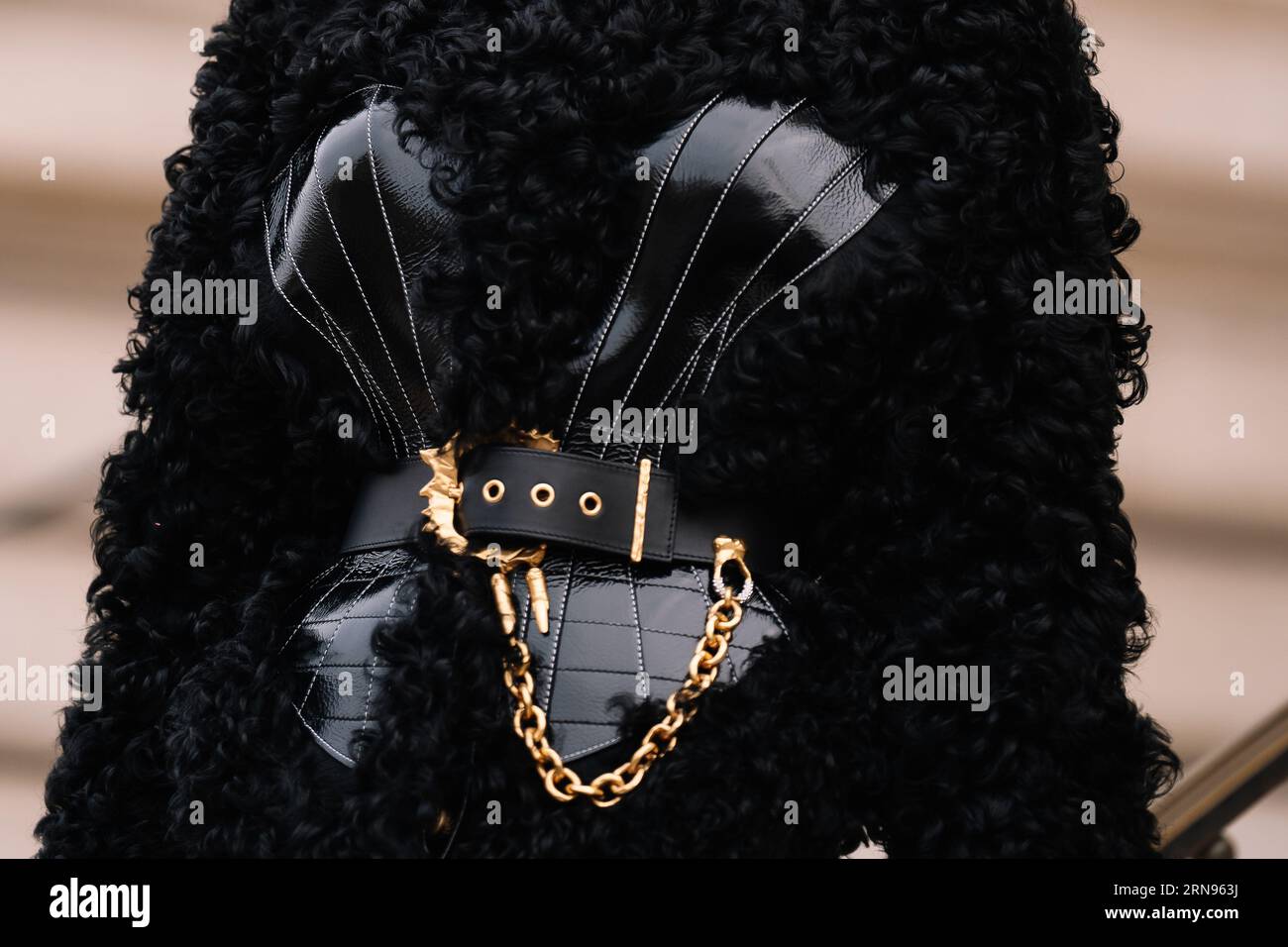 Paris, France - January, 23, 2023: woman wear black shearling cardigan jacket from Schiaparelli Stock Photo
