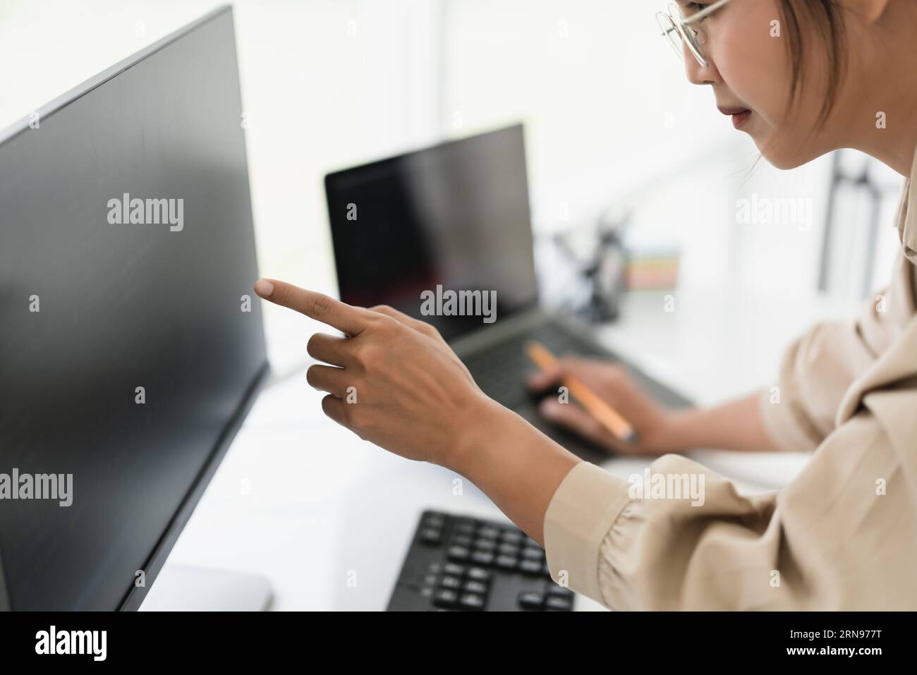 Developer programmer checking code on monitor while programming to developing web and application. Stock Photo