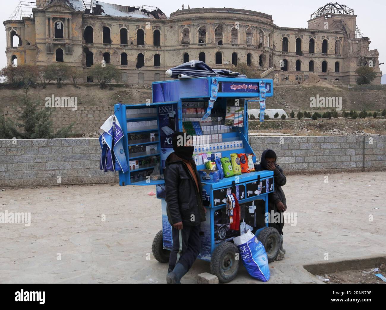 (151122) -- KABUL, Nov. 22, 2015 -- Afghan boys sell cigarettes in front of the Darul Aman Palace, which had been destroyed during the civil war in 1990s, in Kabul, capital of Afghanistan, Nov. 22, 2015. ) AFGHANISTAN-KABUL-DAILY LIFE RahmatxAlizadah PUBLICATIONxNOTxINxCHN   151122 Kabul Nov 22 2015 Afghan Boys Sell Cigarettes in Front of The Darul AMAN Palace Which had been destroyed during The Civil was in 1990s in Kabul Capital of Afghanistan Nov 22 2015 Afghanistan Kabul Daily Life RahmatxAlizadah PUBLICATIONxNOTxINxCHN Stock Photo