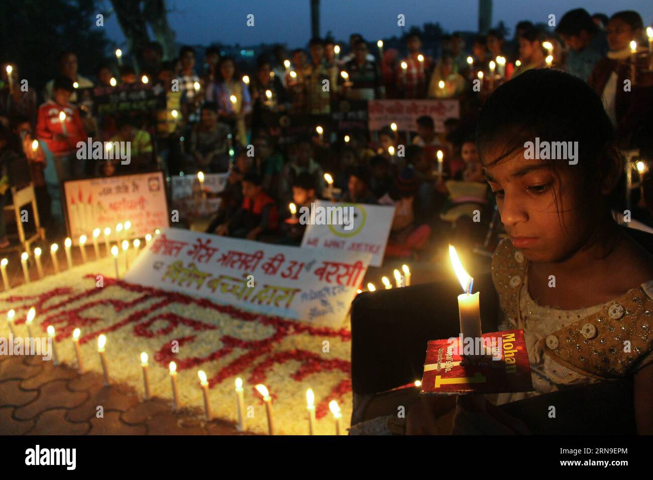 (151202) -- BHOPAL, Dec. 1, 2015 () -- Survivors descendants with congenital disabilities light candles during a vigil marking the 31st anniversary of the gas tragedy in Bhopal, India, Dec. 1, 2015. More than 15,000 residents were killed by the gas leakage from the Union Carbide pesticide plant on the night of Dec. 1 to 3, 1984 in Bhopal, considered the world s worst industrial disaster. (/Stringer) INDIA-BHOPAL-BHOPAL DISASTER-CONDOLENCE Xinhua PUBLICATIONxNOTxINxCHN   151202 Bhopal DEC 1 2015 Survivors descendants With congenital Disabilities Light Candles during a Vigil marking The 31st Ann Stock Photo