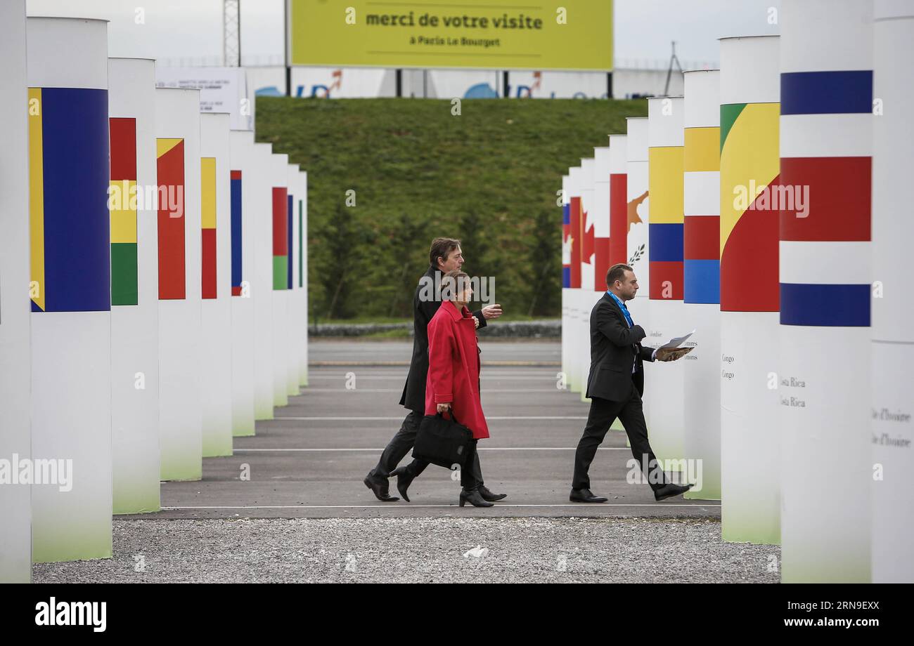 151202 -- PARIS, Dec. 2, 2015 -- People walk at the site of the 2015 United Nations Climate Change Conference COP 21 at Le Bourget on the northern suburbs of Paris, France, Dec. 2, 2015. The Paris climate talks entered stage of substantive negotiations on Tuesday as negotiators began to turn political will that their leaders expressed into concrete solutions to various disputes over a new climate agreement. Officials from 195 countries have one final week to slim the agreement draft which now runs over 50 pages to a manageable level so that their ministers could read when they join the table n Stock Photo