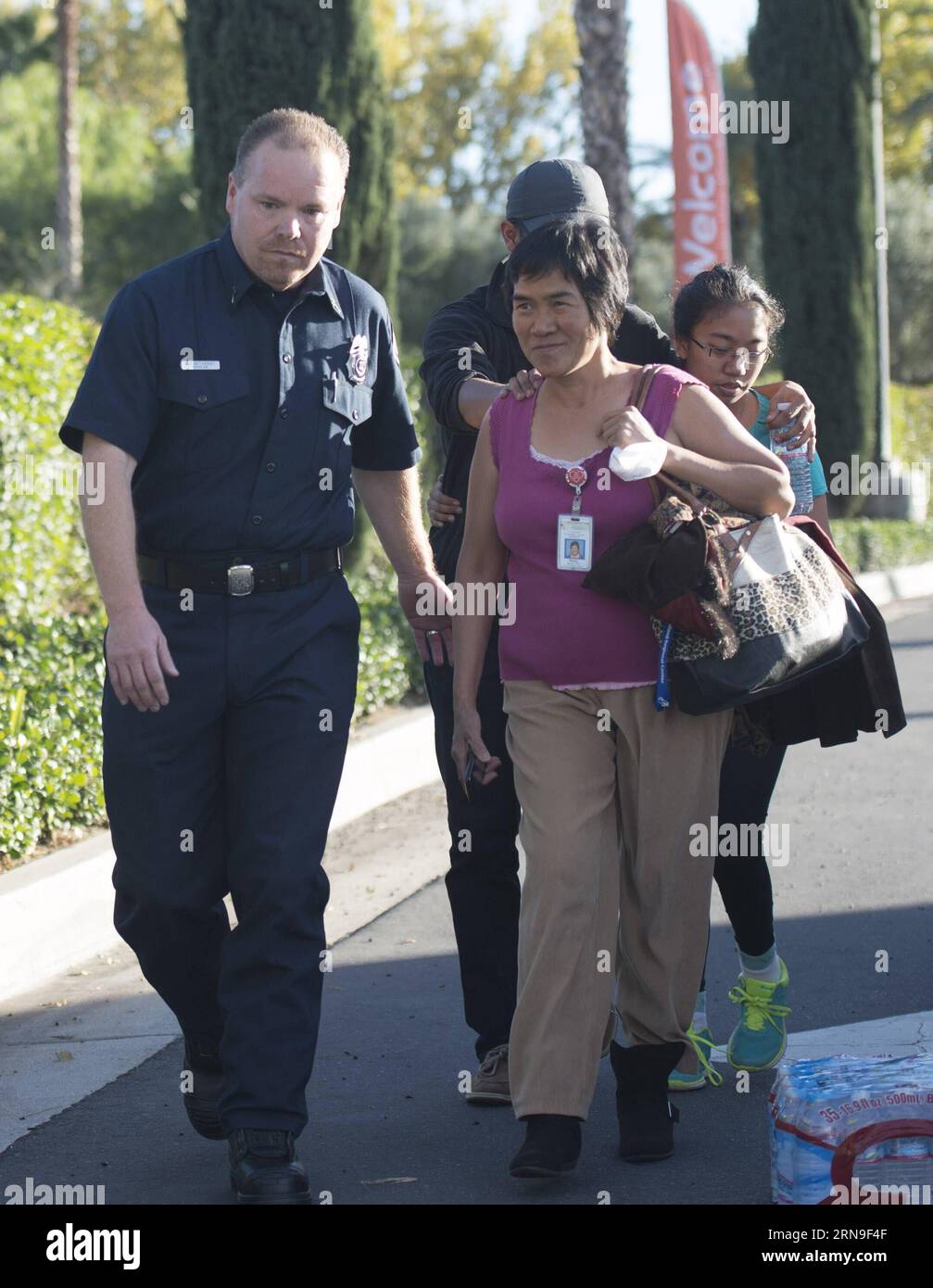 (151203) -- LOS ANGELES, Dec. 3, 2015 -- A survivor (R) of the mass shooting at the Inland Regional Center meets her family after police questioning in San Bernardino City of Southern California, the United States, Dec. 2, 2015. One suspect was gunned down and one in custody Wednesday afternoon after a shooting killed at least 14 people and injured 14 others in San Bernardino, local media reported. ) (zw) U.S.-SAN BERNARDINO-SHOOTING YangxLei PUBLICATIONxNOTxINxCHN   Los Angeles DEC 3 2015 a Survivor r of The Mass Shooting AT The Domestically Regional Center Meets her Family After Police Quest Stock Photo