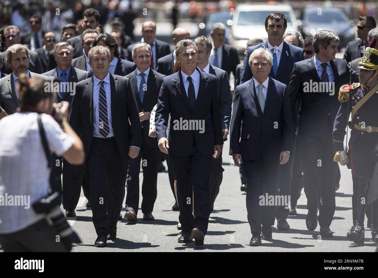 (151211) -- BUENOS AIRES, Dec. 11, 2015 -- Argentina s President Mauricio Macri (C) walks on May Avenue with his Cabinet to participate in the Tedeum at the Metropolitan Cathedral in Buenos Aires, capital of Argentina, Dec. 11, 2015. According to local press, Mauricio Macri Friday attended the traditional religious service at the Metropolital Cathedral, one day after his pesidential inauguration. Martin Zabala) (jg) (fnc) ARGENTINA-BUENOS AIRES-POLITICS-PRESIDENT e MARTINxZABALA PUBLICATIONxNOTxINxCHN   151211 Buenos Aires DEC 11 2015 Argentina S President Mauricio Macri C Walks ON May Avenue Stock Photo
