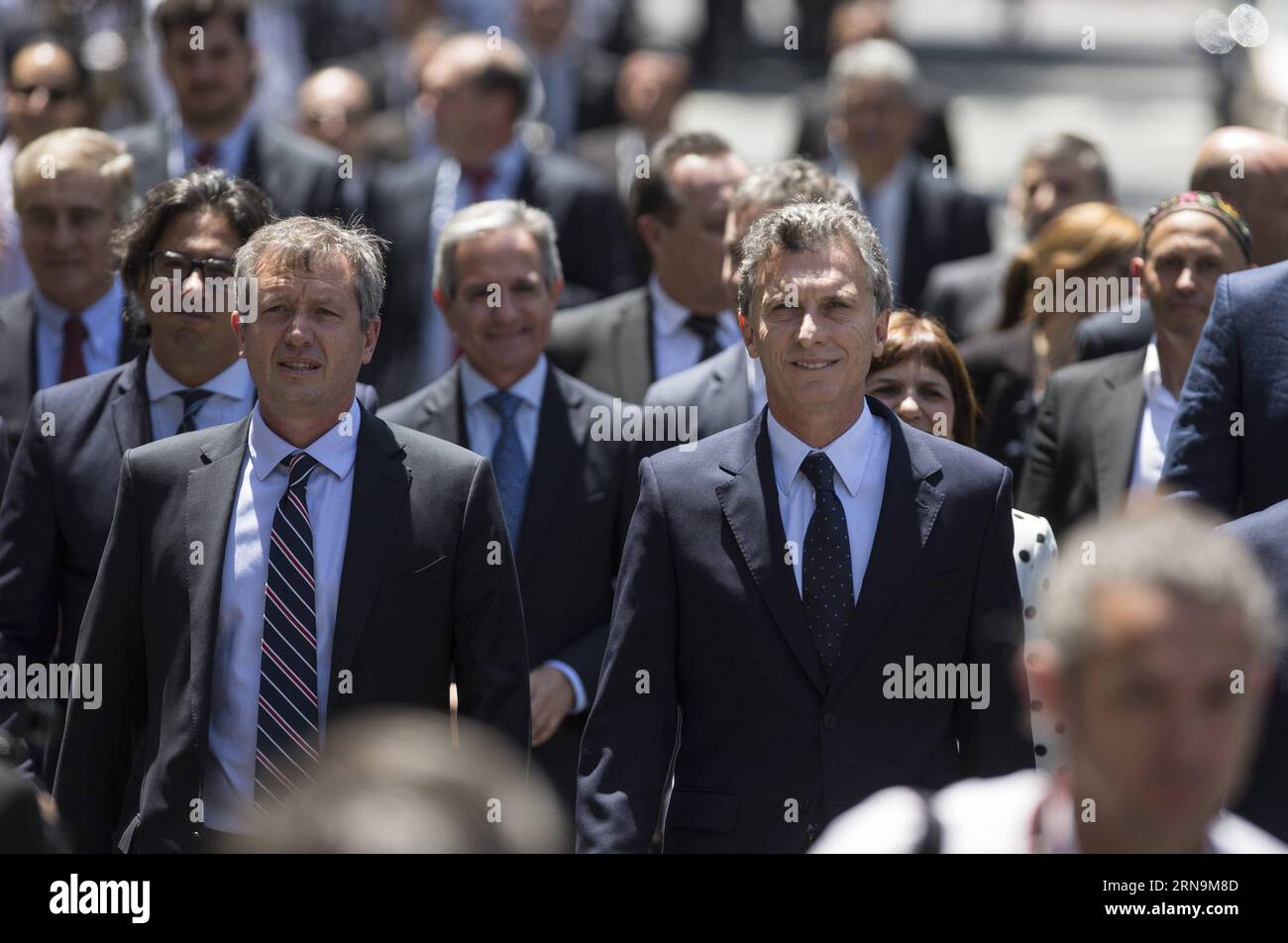 (151211) -- BUENOS AIRES, Dec. 11, 2015 -- Argentina s President Mauricio Macri (R, front) walks on May Avenue with his Cabinet to participate in the Tedeum at the Metropolitan Cathedral in Buenos Aires, capital of Argentina, Dec. 11, 2015. According to local press, Mauricio Macri Friday attended the traditional religious service at the Metropolital Cathedral, the day after his pesidential inauguration. Martin Zabala) (jg) (fnc) ARGENTINA-BUENOS AIRES-POLITICS-PRESIDENT e MARTINxZABALA PUBLICATIONxNOTxINxCHN   151211 Buenos Aires DEC 11 2015 Argentina S President Mauricio Macri r Front Walks O Stock Photo