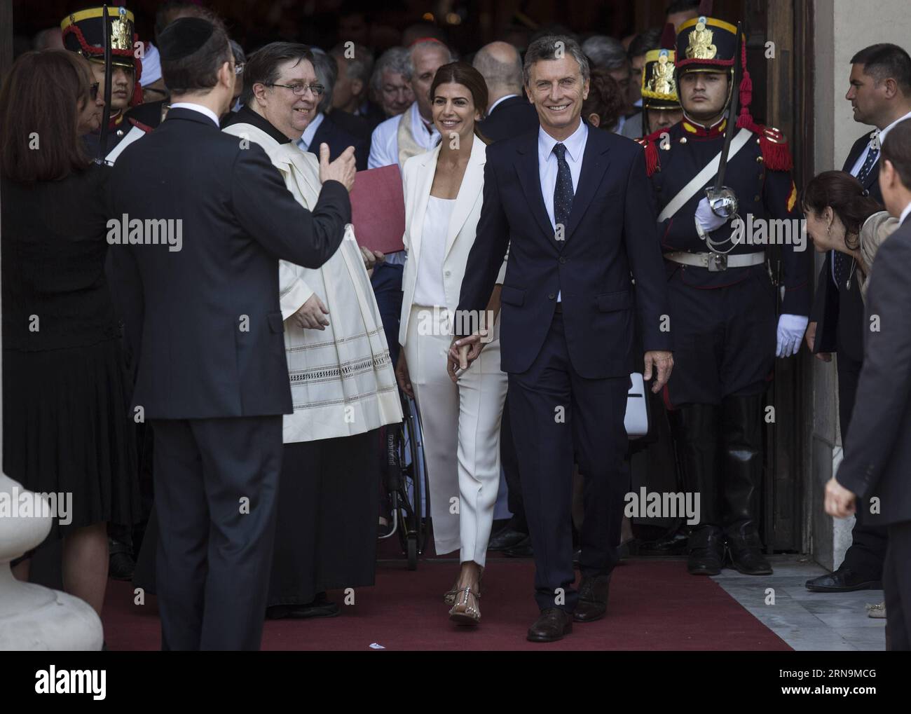 (151211) -- BUENOS AIRES, Dec. 11, 2015 -- Argentina s President Mauricio Macri (R) leaves with First Lady Juliana Awada (L) after taking part in the Tedeum at the Metropolitan Cathedral in Buenos Aires, capital of Argentina, Dec. 11, 2015. According to local press, Mauricio Macri attended Friday with Argentina s Vice President Gabriela Michetti and his Cabinet the traditional religious service at the Metropolital Cathedral, one day after his pesidential inauguration. Martin Zabala) (jg) (fnc) ARGENTINA-BUENOS AIRES-POLITICS-PRESIDENT e MARTINxZABALA PUBLICATIONxNOTxINxCHN   151211 Buenos Aire Stock Photo