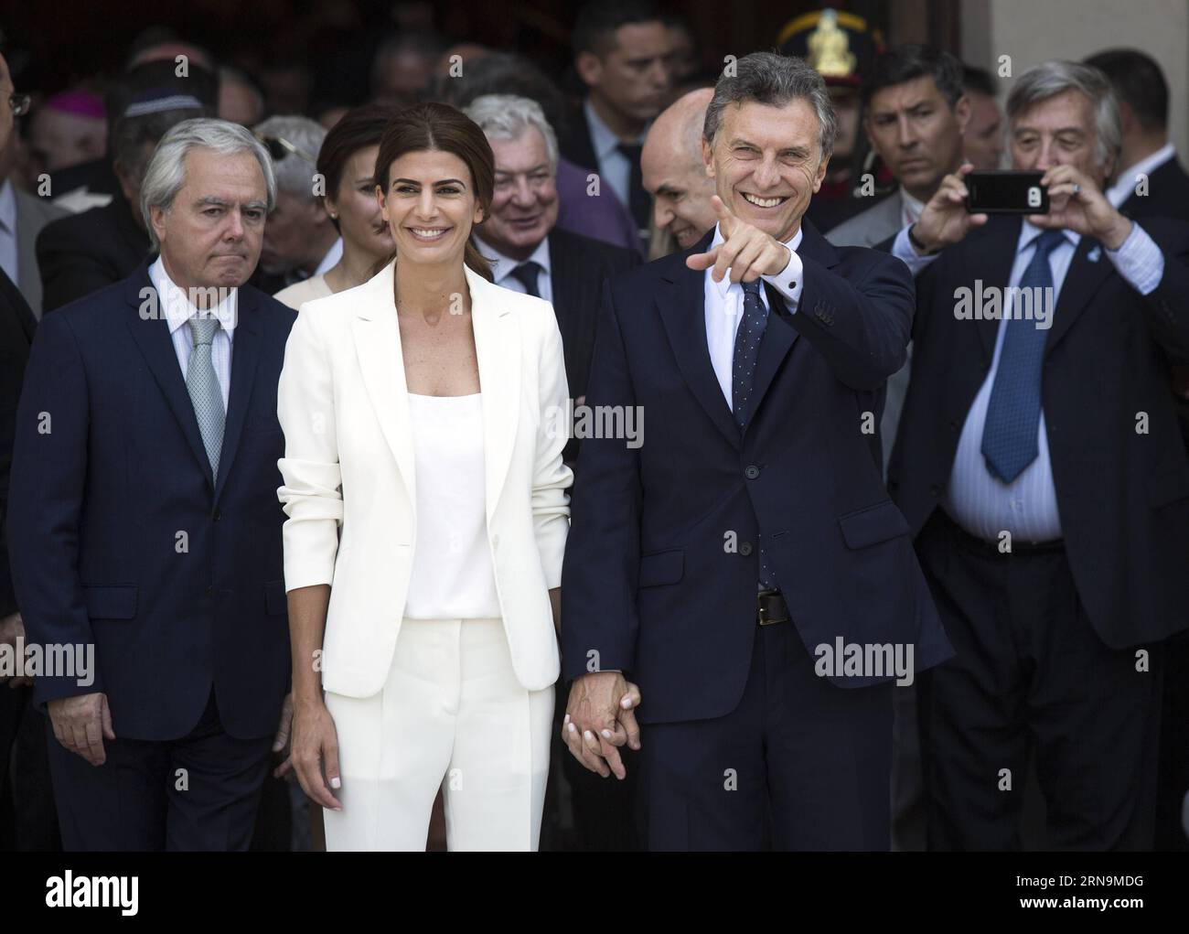 (151211) -- BUENOS AIRES, Dec. 11, 2015 -- Argentina s President Mauricio Macri (2nd R) leaves with First Lady Juliana Awada (2nd L) after taking part in the Tedeum at the Metropolitan Cathedral in Buenos Aires, capital of Argentina, Dec. 11, 2015. According to local press, Mauricio Macri attended Friday with Argentina s Vice President Gabriela Michetti and his Cabinet the traditional religious service at the Metropolital Cathedral, one day after his pesidential inauguration. Martin Zabala) (jg) (fnc) ARGENTINA-BUENOS AIRES-POLITICS-PRESIDENT e MARTINxZABALA PUBLICATIONxNOTxINxCHN   151211 Bue Stock Photo