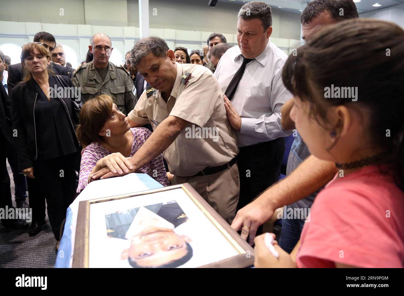 Argentina s Vice President Gabriela Michetti (2nd L) accompanies the relatives of the officers that were killed in an accident, at the Forum Conventions Center, Santiago del Estero, Argentina, Dec. 15, 2015. Argentina s President Mauricio Macri (not in the photo) has announced a 24-hour national mourning for the 43 national officers that died on Monday when their bus tipped over, near the locality of Rosario de la Frontera, in Salta Province, northeast Argentina. Emilio Rapetti/) (rtg) (ah) ARGENTINA-SANTIAGO DEL ESTERO-ACCIDENT-BUS TELAM PUBLICATIONxNOTxINxCHN   Argentina S Vice President Gab Stock Photo