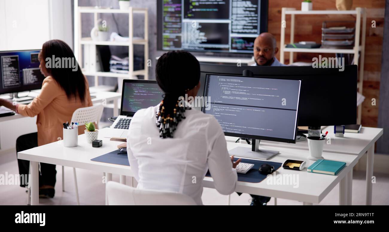 African Business Team Working On Computer. Software App Development Stock Photo