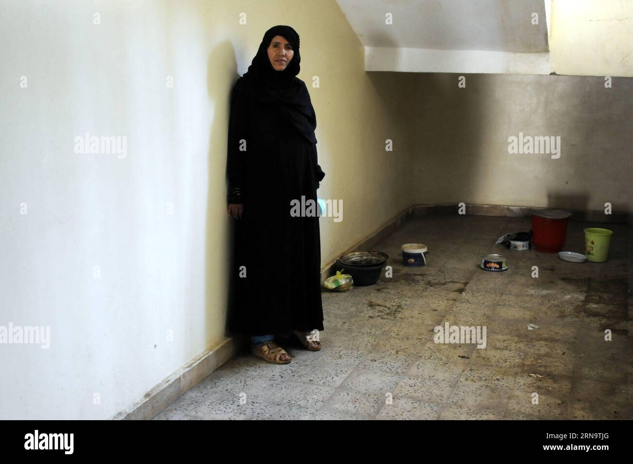 A Yemeni woman stands at a temporary evacuation center in Sanaa, capital of Yemen, Dec. 19, 2015, as her family was forced to flee from home due to the ongoing air strikes and internal conflicts. According to the United Nations High Commissioner for Refugees (UNHCR), there are 2.5 million internal displaced persons (IDPs) as a result of the nine-month civil war in Yemen. Hani Ali) YEMEN-SANAA-DISPLACED PEOPLE MohammedxMohammed PUBLICATIONxNOTxINxCHN   a Yemeni Woman stands AT a temporary Evacuation Center in Sanaa Capital of Yemen DEC 19 2015 As her Family what Forced to Flee from Home Due to Stock Photo