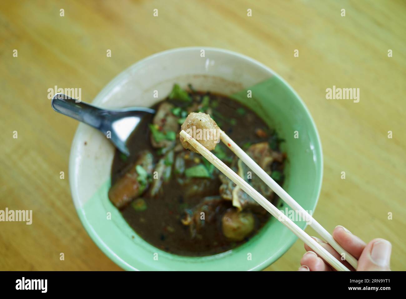 Rice stick noodles with braised beef and meatball in a bowl Stock Photo